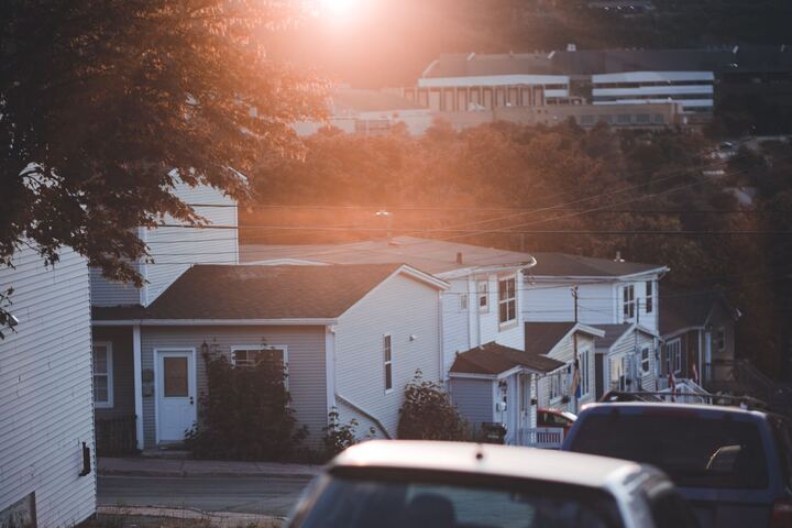 Houses along a residential street in warm evening light