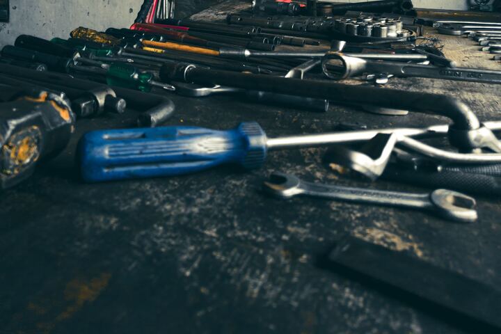 Hand tools arranged on a workshop bench